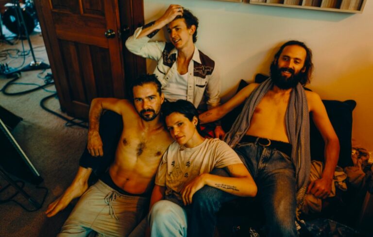 The members of Big Thief pose for a laid-back photo