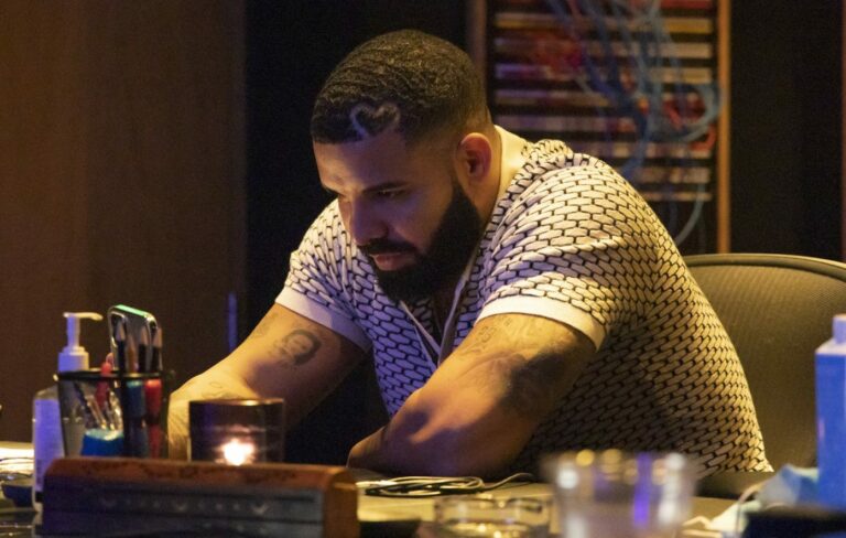 Drake poses in a press shot