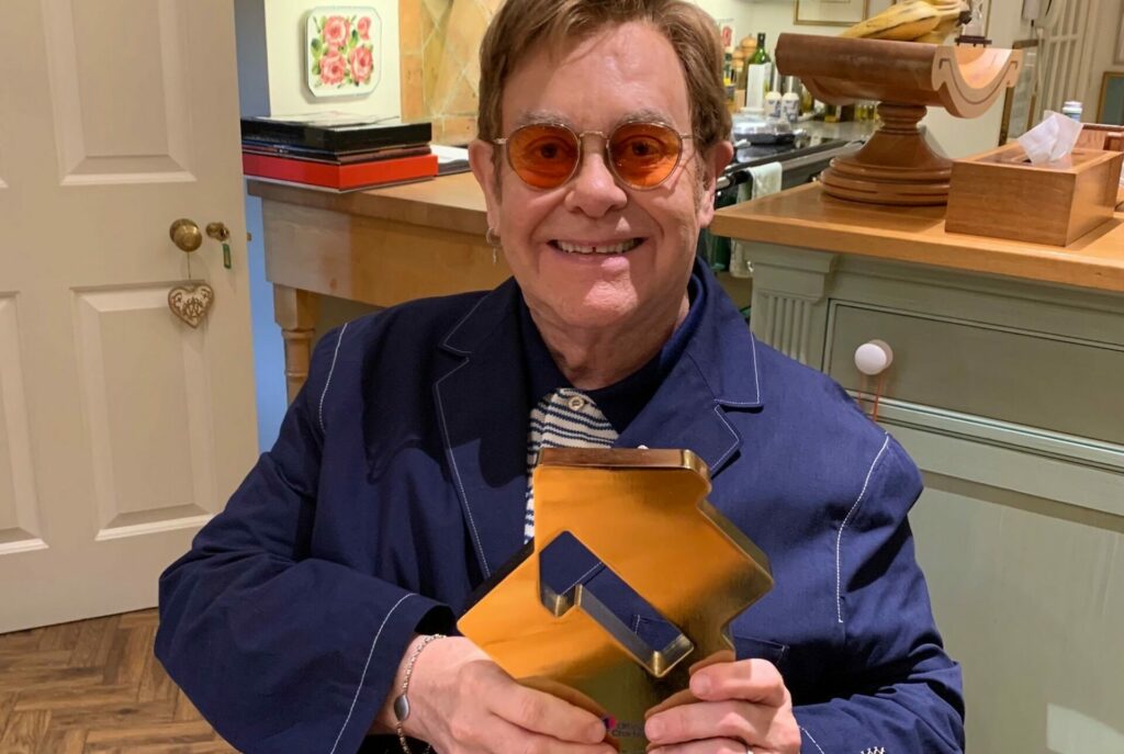 Elton John with his Official Number 1 Album award for The Lockdown Sessions