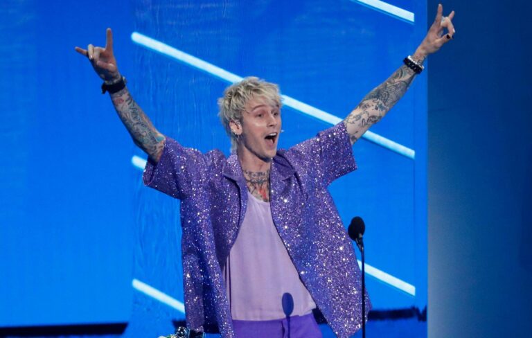 Machine Gun Kelly poses at the MTV VMAs