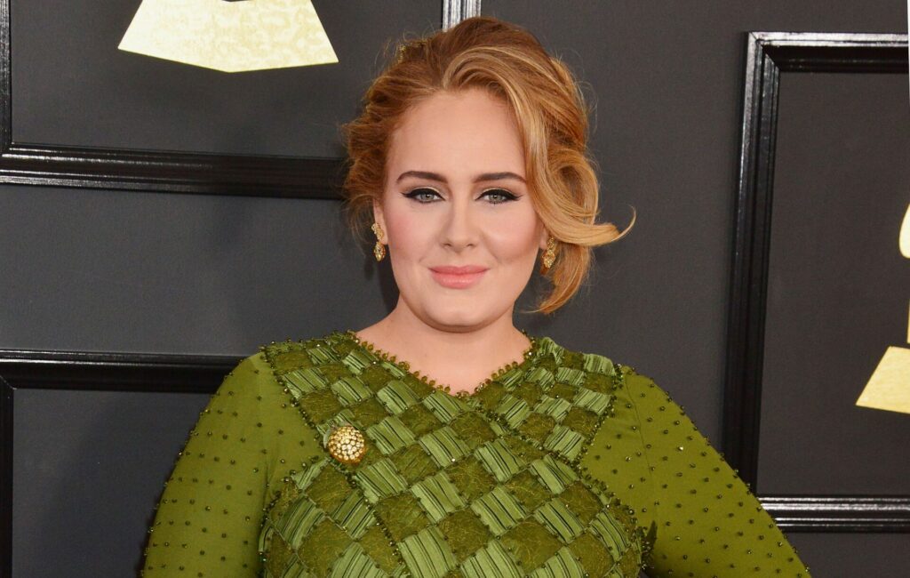 Adele wears a green dress at at the 59th Annual Grammy Awards