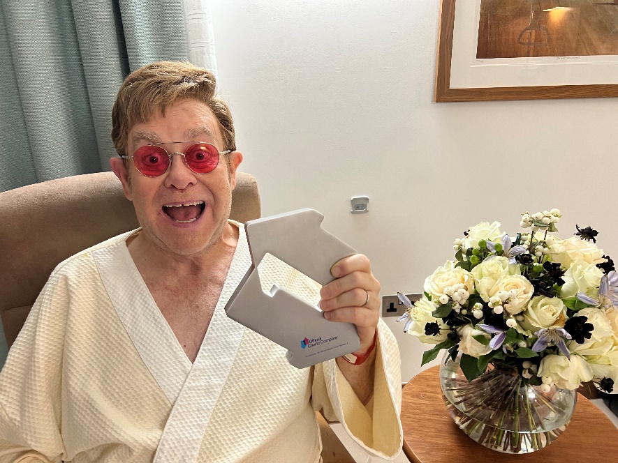 Elton John poses with his Official Number 1 Single Award for 'Cold Heart (Pnau Remix)'.