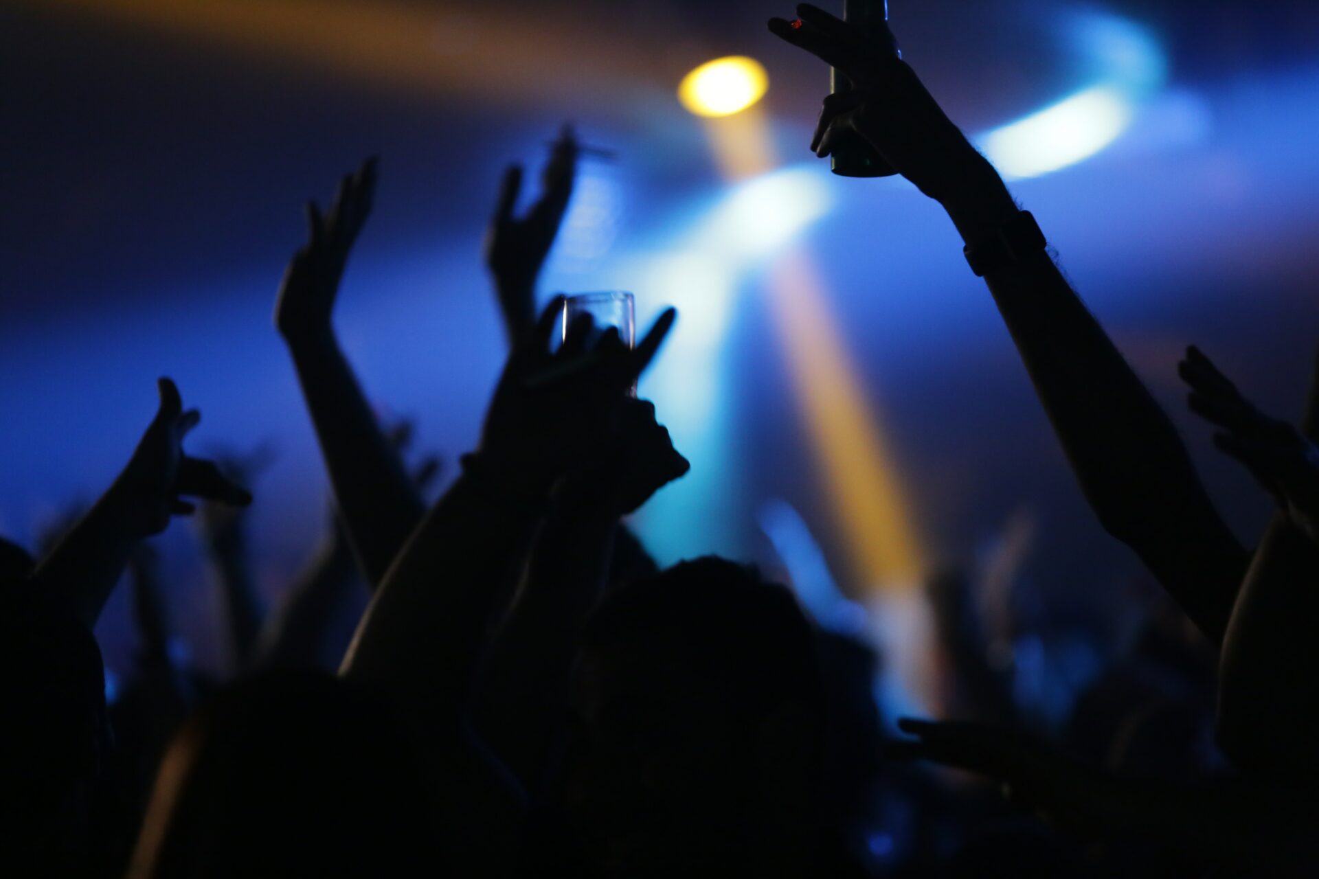 A drink held by a club goer