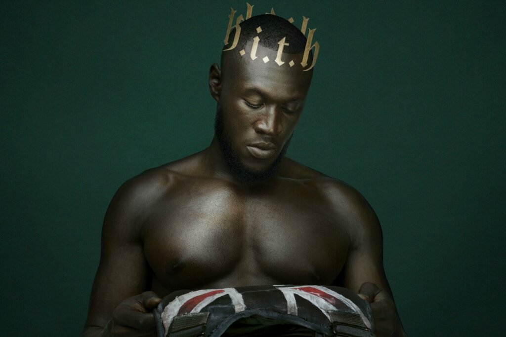Stormzy looking at a Union Jack