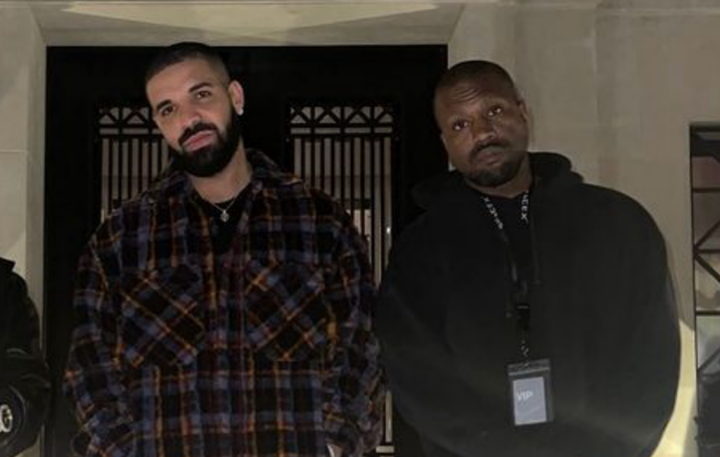Drake and Kayne West stand together for a photo at Drake's house