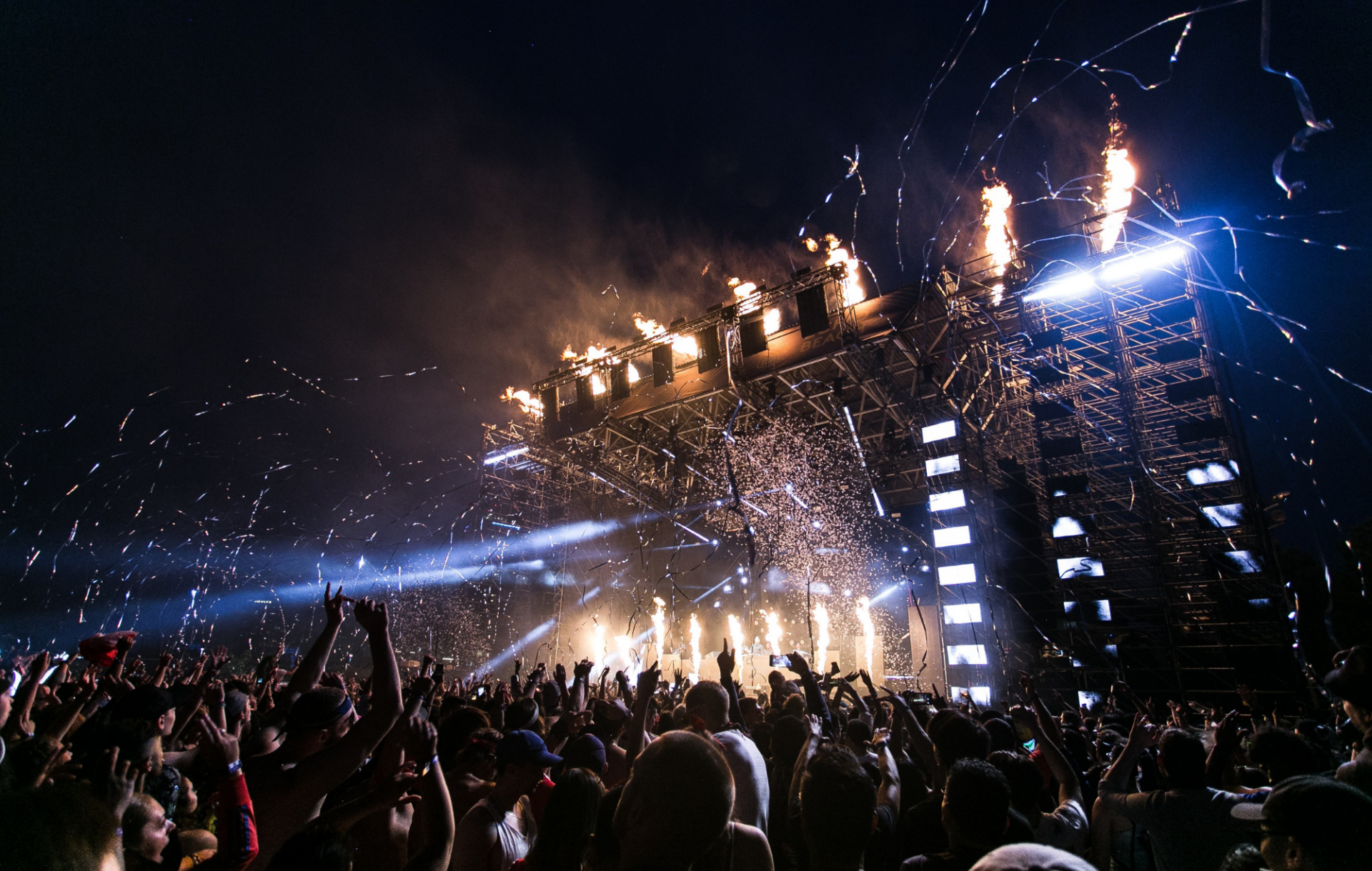 Lights and streamers go off at a live music festival