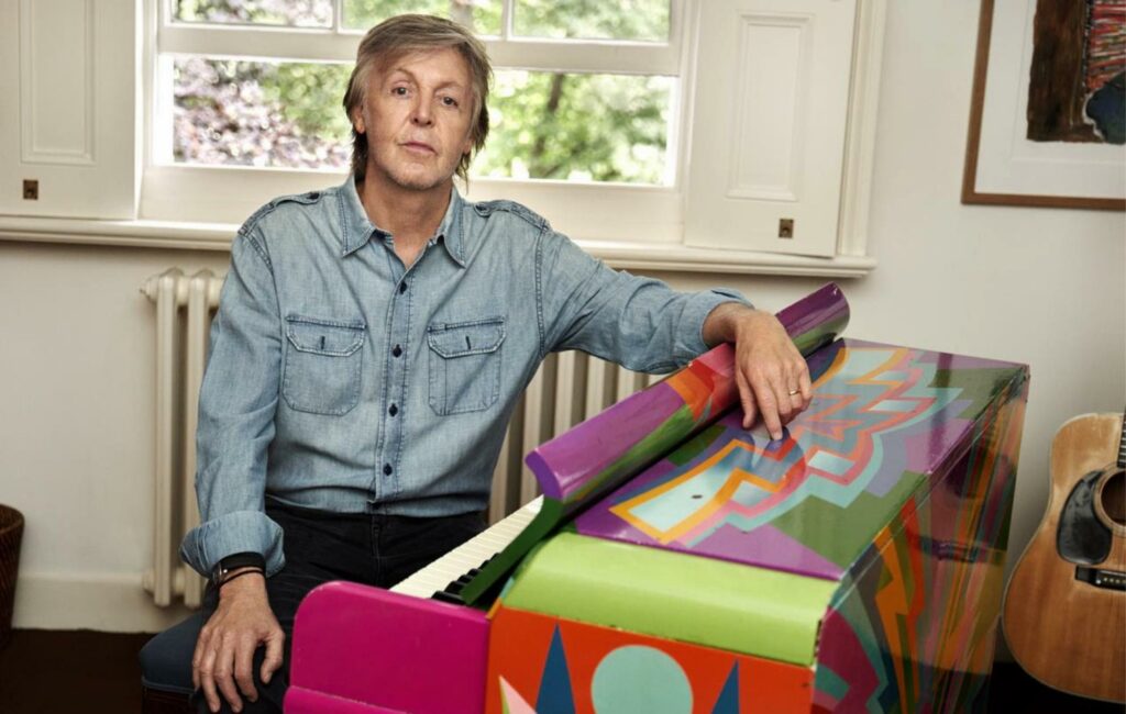 Paul McCartney pictured at home with his original 'Magic Piano'