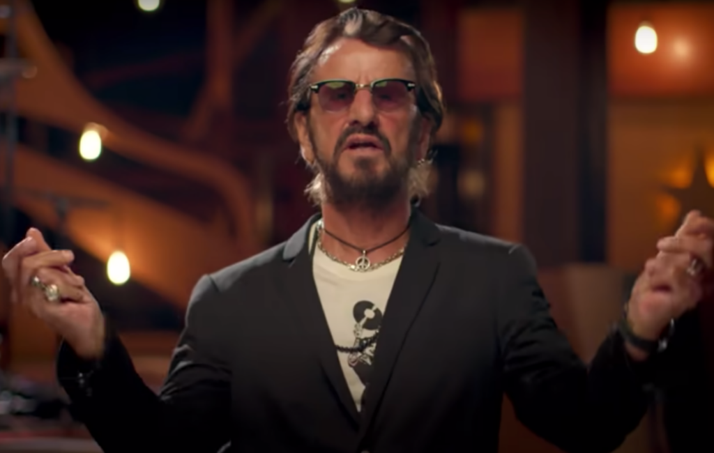 Ringo Starr wears a dark blazer and sunglasses