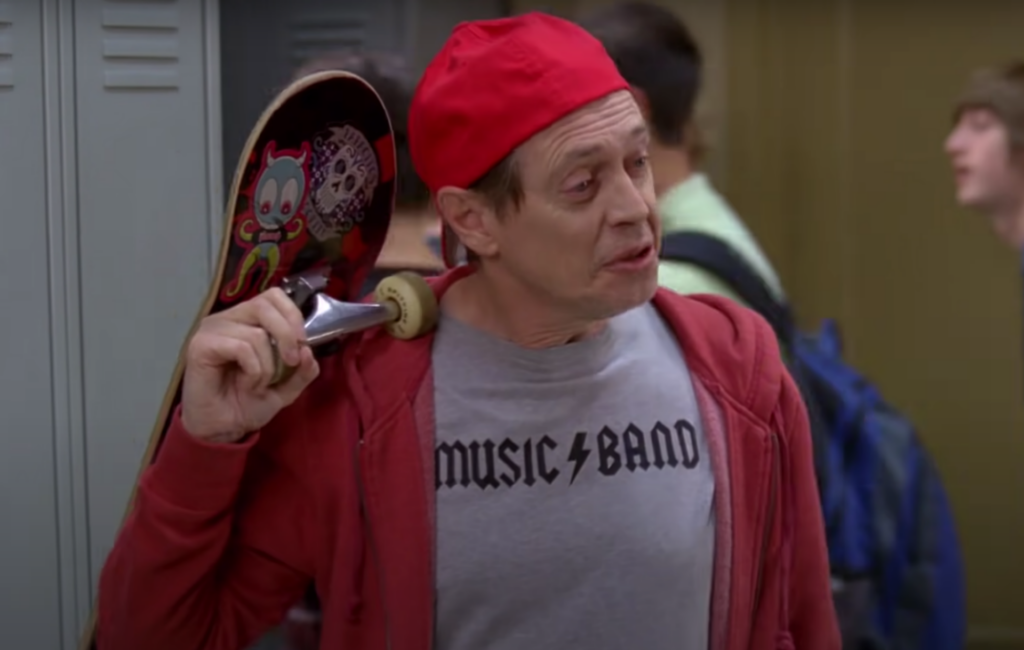 Steve Buscemi appears in a red cap and holds a skateboard in an episode of '30 Rock' which has now become a meme