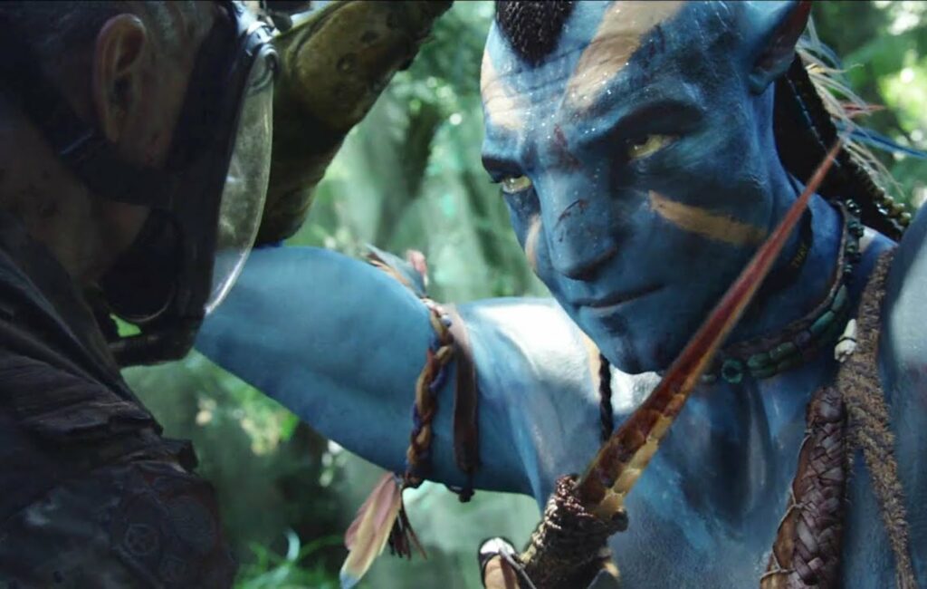 A screengrab from 'Avatar', which sees a blue-skinned Na'vi face to face with a human