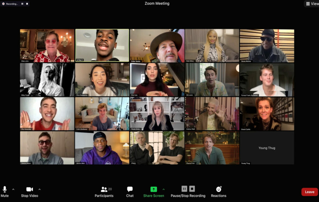 Elton John and his collaborators all look to the camera on a group Zoom call