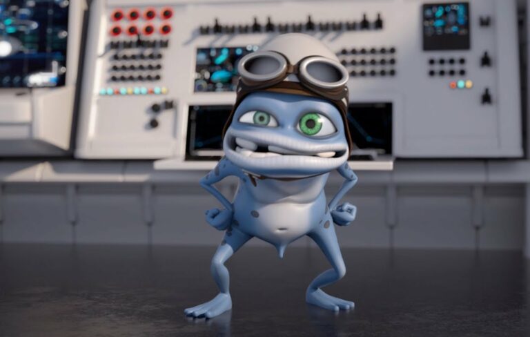 The Crazy Frog cartoon looking at the camera in a control room.