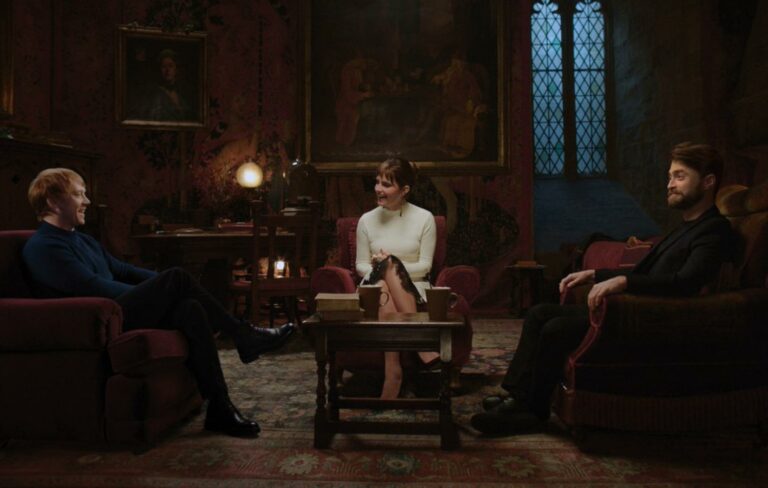 Rupert Grint and Emma Watson and Daniel Radcliffe are seen seated in Gryffindor's common room