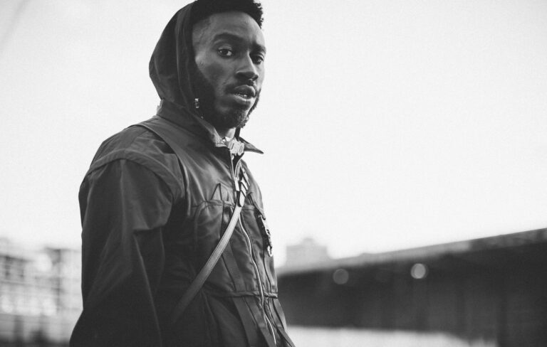 Kojey Radical poses in a black and white portrait shot 2020