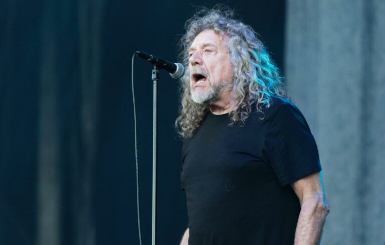Robert Plant is seen performing live wearing a black T-shirt