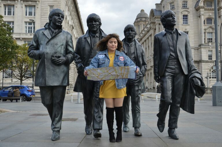 Stephanie Hernandez poses with the Fab Four