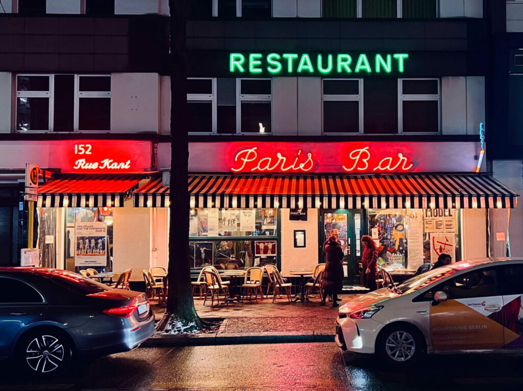 Neon Lights on a restaurant that read 'Paris Bar' and 'Restaurant