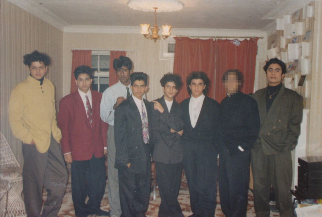 A group of South Asian friends are dressed in suits for a Daytimers event