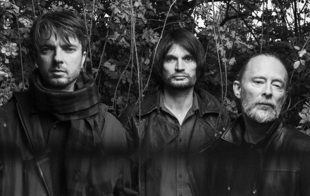 black-and-white press shot of The Smile – aka Tom Skinner, Jonny Greenwood and Thom Yorke