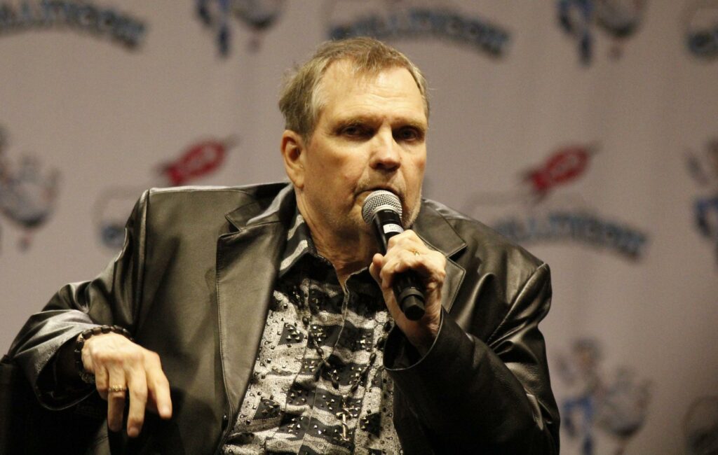 Meat Loaf is pictured talking at a panel in 2019