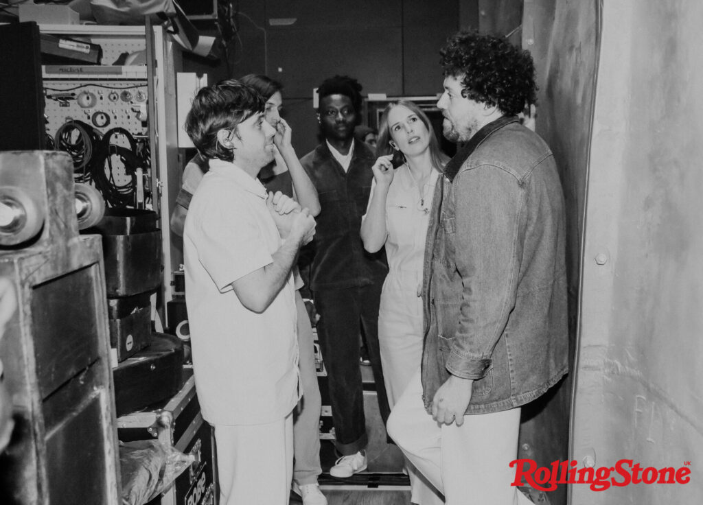 Metronomy stand in a narrow hallway near electrical equipment facing each other