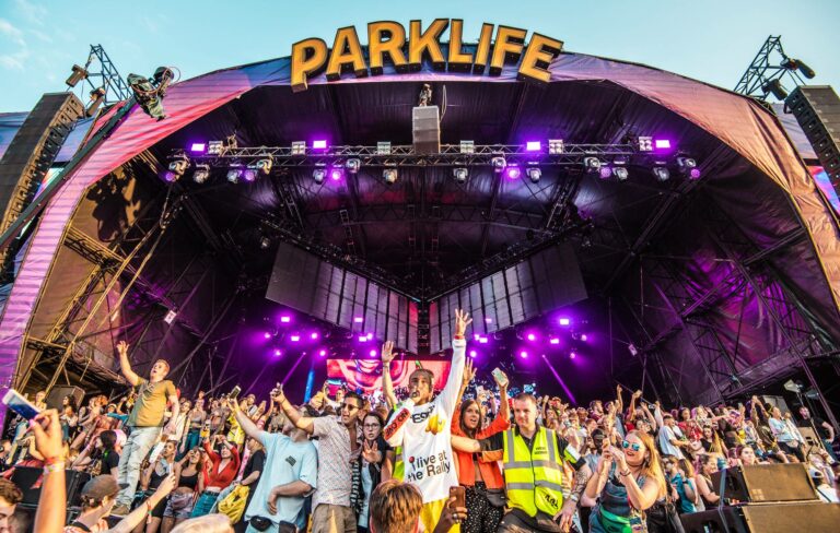 Fans gather on the stage at Manchester's Parklife festival