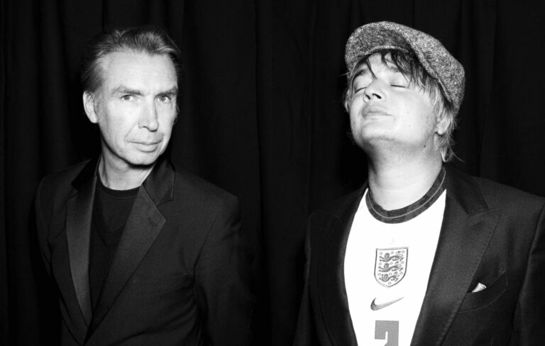 Frédéric Lo (l) and Pete Doherty (r) pose in a black-and-white image