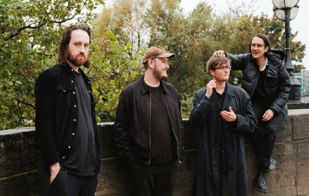 Members of Yard Act pose by a wall