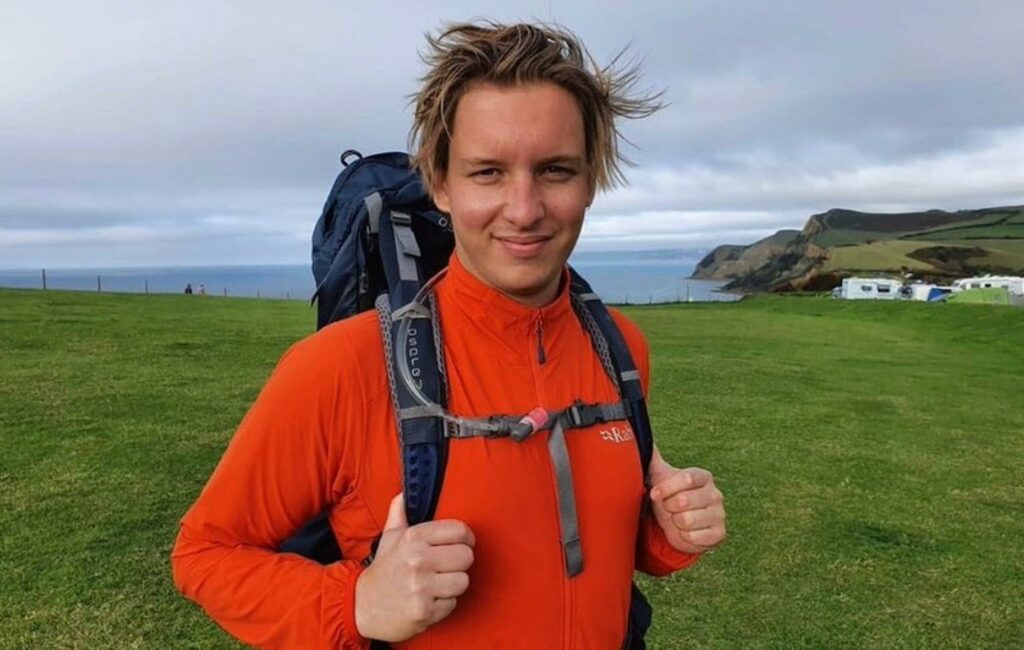 George Ezra poses wearing a backpack on his 'End To End' expedition