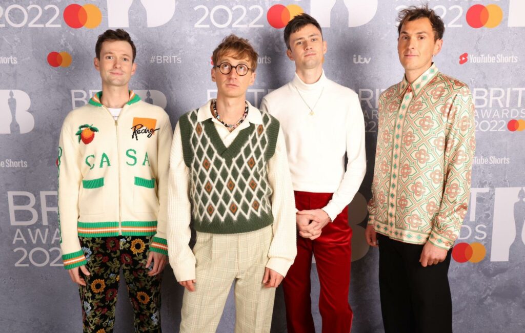 Glass Animals pose on the BRIT Awards red carpet after receiving two nominations in 2022
