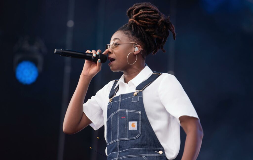 Little Simz wears dungarees as she performs live in 2019