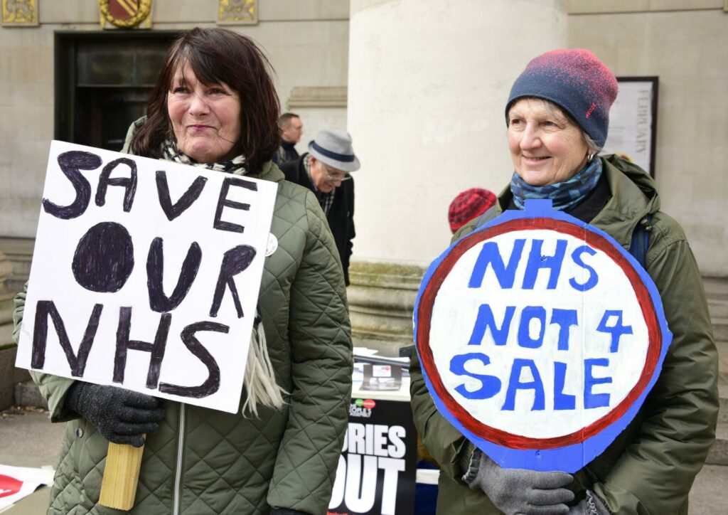 NHS campaigners at a recent protest (Picture: Alamy)