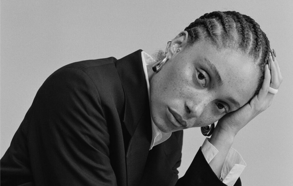 Adwoa Aboah poses in a black-and-white photo for 'Top Boy' promo