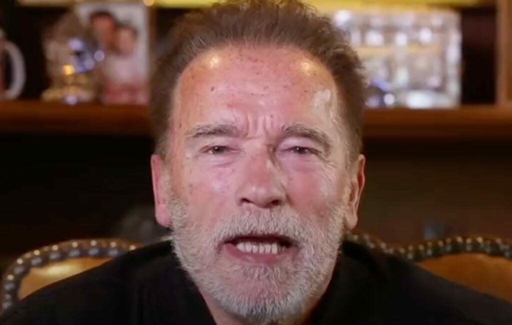 Arnold Schwarzenegger addresses the camera in a close up shot