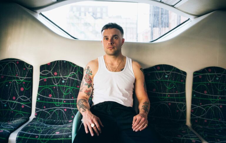Baby Dave aka Slaves frontman Isaac Holman sits on a bus