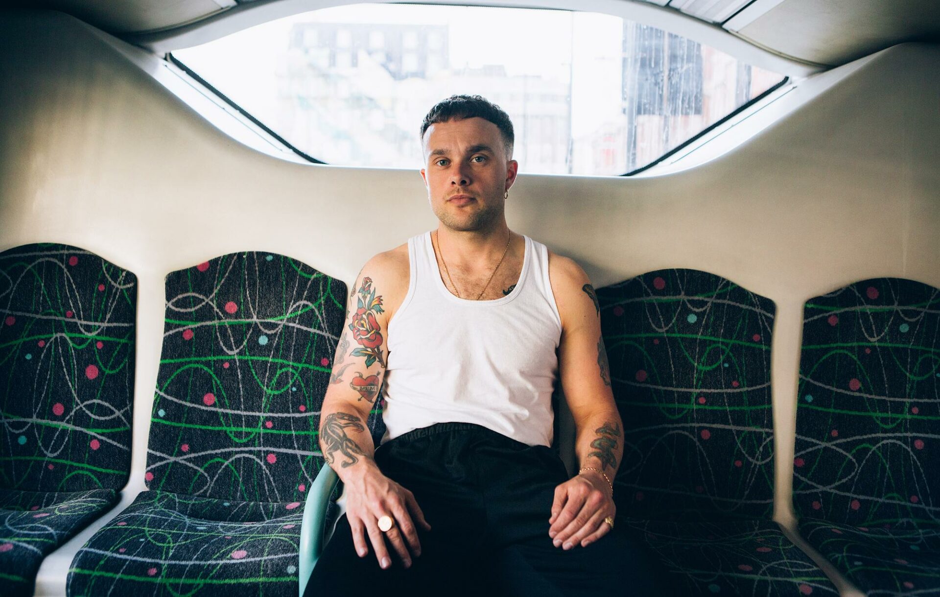 Baby Dave aka Slaves frontman Isaac Holman sits on a bus