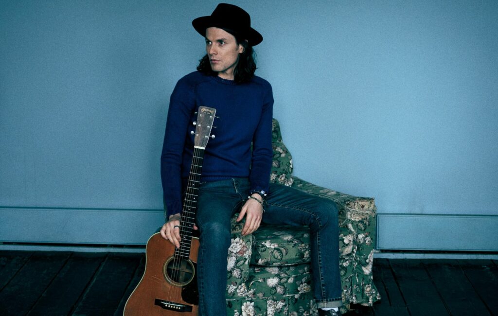 James Bay poses with his guitar