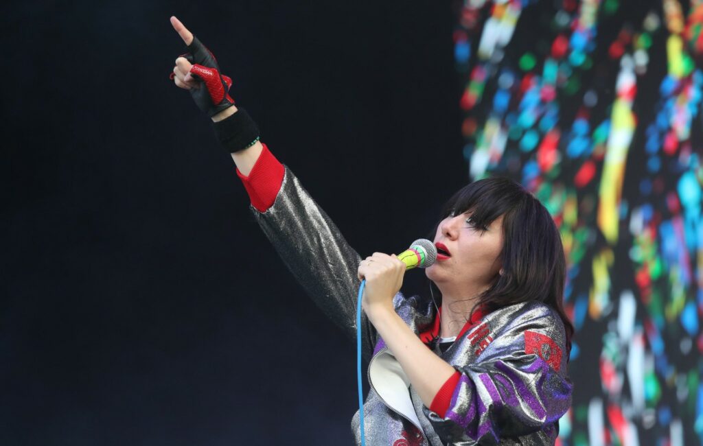Karen O of the Yeah Yeah Yeahs performs live in a silver jacket
