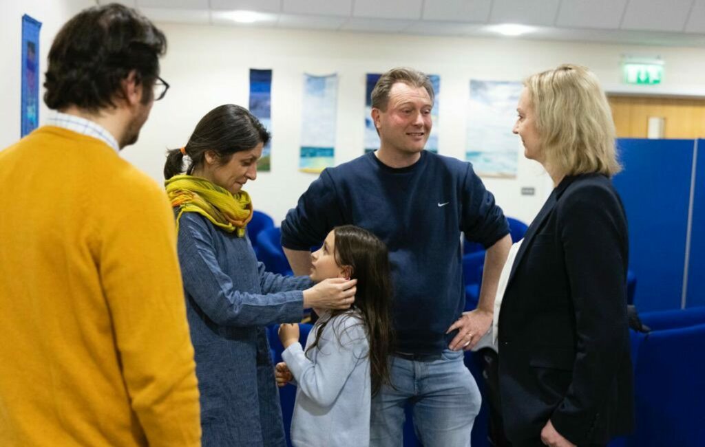 Nazanin Zaghari-Ratcliffe holds her daughter's face as she arrives back in the UK