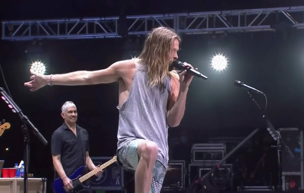 Taylor Hawkins takes the mic to cover Queen's 'Somebody to Love' i n Chile last week, at his penultimate Foo Fighters show, March 18, 2022