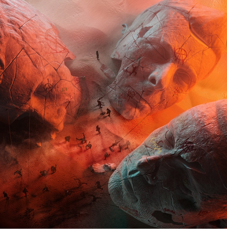Three huge busts of Muse are half buried in red sands on the new album cover 