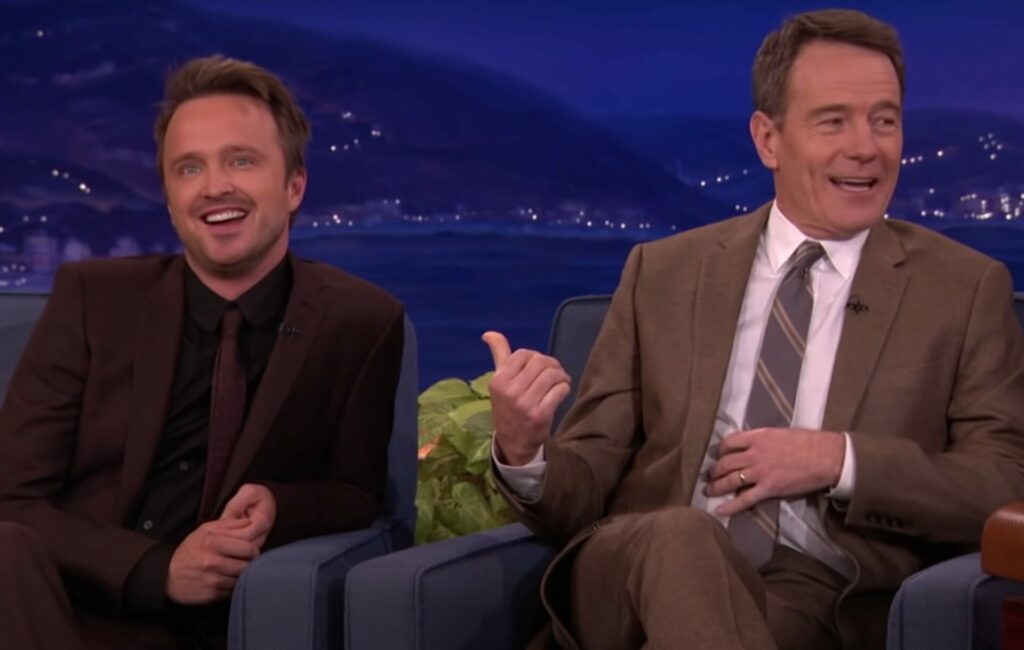 Aaron Paul and Bryan Cranston together on a talk show couch