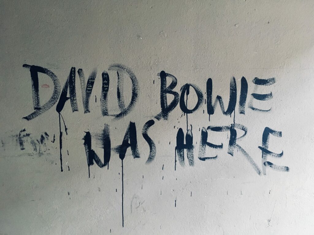 Street graffiti that reads "David Bowie was here"