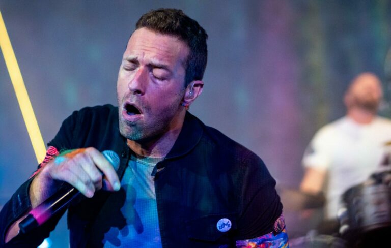 Chris Martin of Coldplay is seen performing live in 2021
