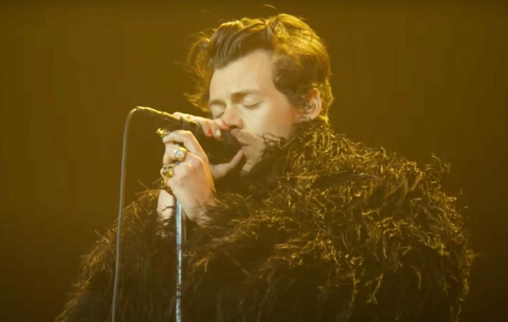 Harry Styles wears a feathered jacket at Coachella
