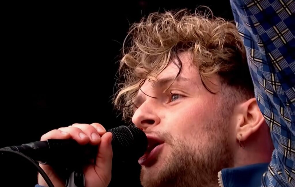 A close up shot of Tom Grennan performing live at Reading 2021