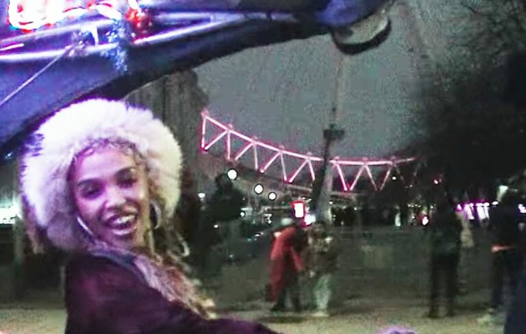 FKA twigs laughs on a bus in front of the London eye