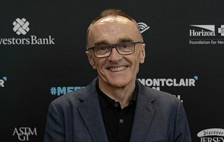 Danny Boyle poses for a photo at a corporate event