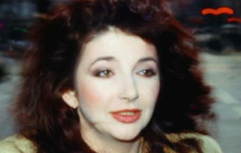 A photo of Kate Bush standing on a street