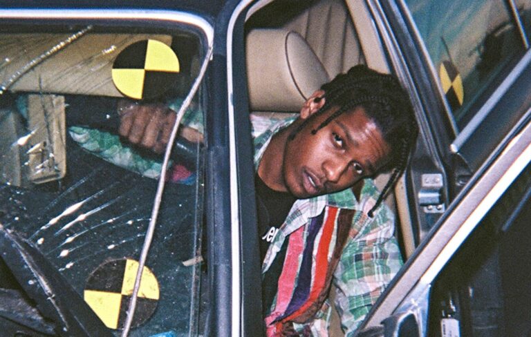 A$AP Rocky leaning out of a car window for a press photo